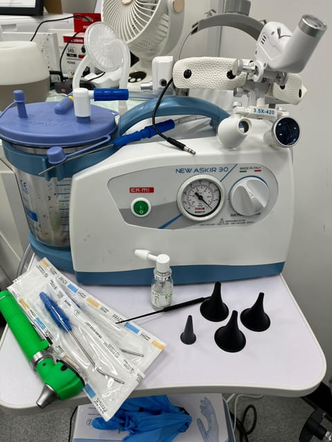 The microsuction unit, ear specula and single-use instruments used for ear wax removal